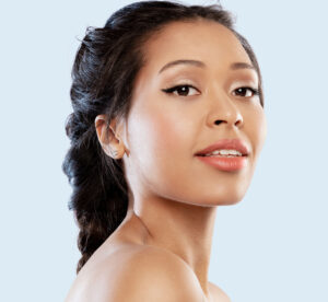 Young woman with perfect glowing facial skin and even complexion