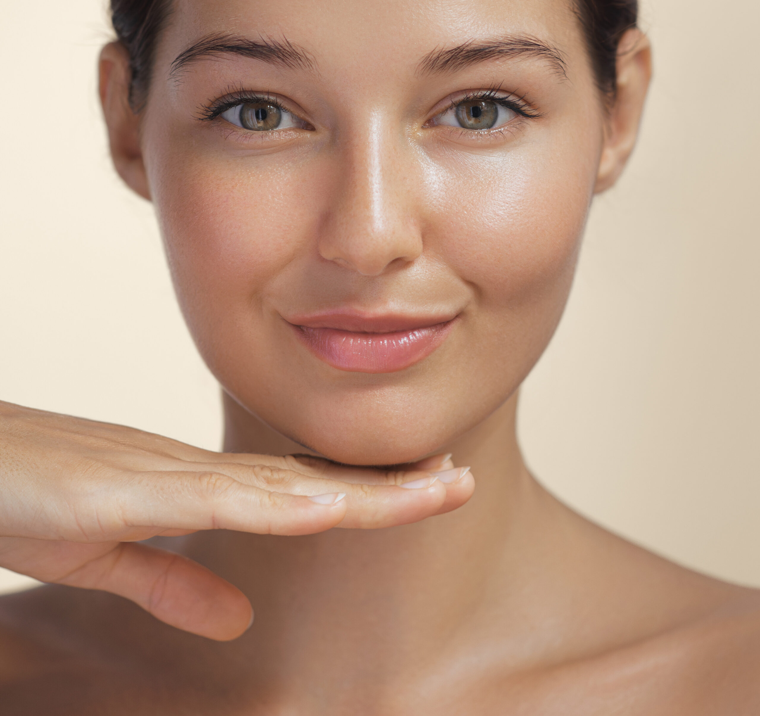 Young woman with clear, glowing skin and smooth, even complexion